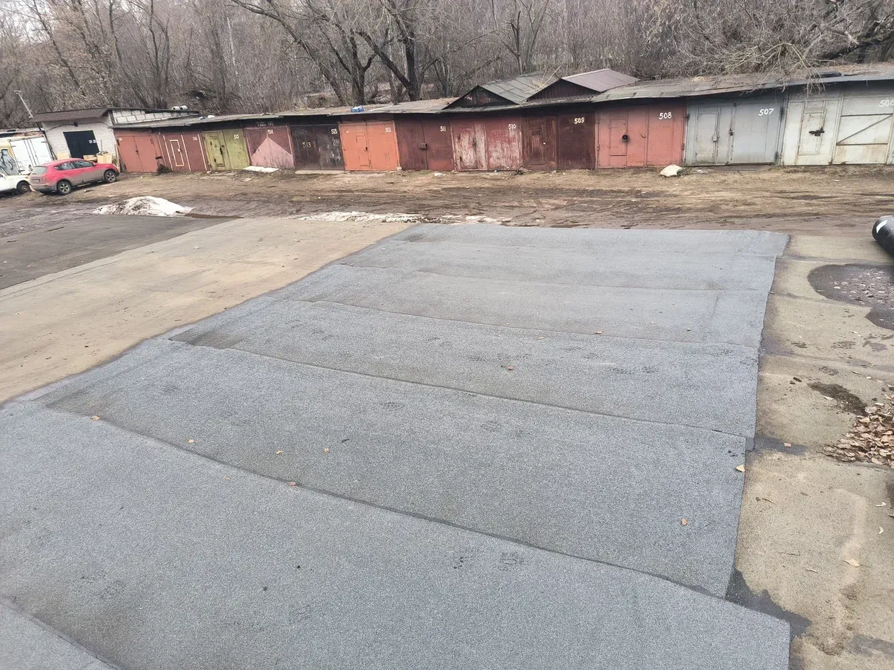 Готовая кровля гаража после ремонта с отсечкой от соседнего гаража на Пискаревском проспекте