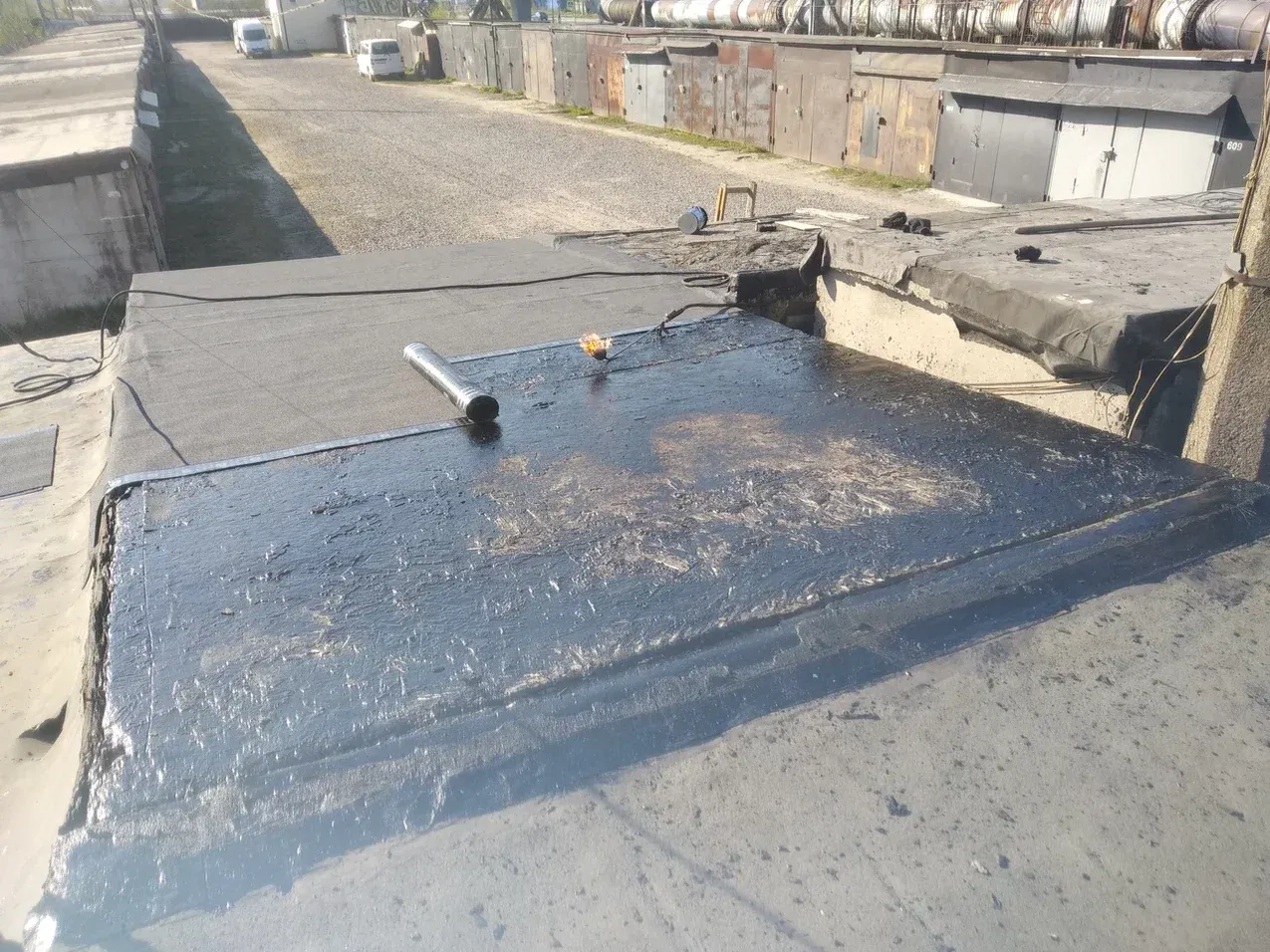 Ремонт кровли гаража в Мурино после демонтажа старого покрытия и наплавления УНИФЛЕКС ЭКП